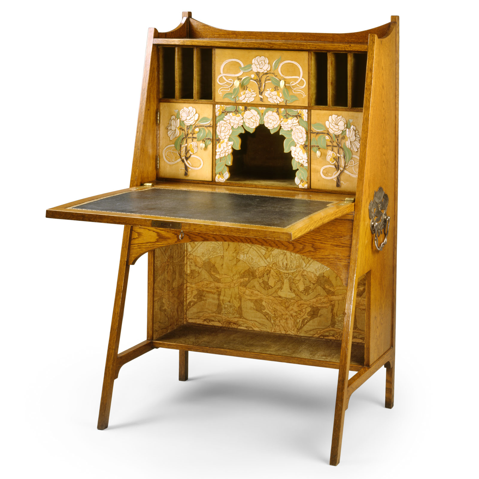 A wooden Art Nouveau writing desk with a drop-front surface, featuring painted floral panels of white roses and an etched scene of figures on the lower back panel