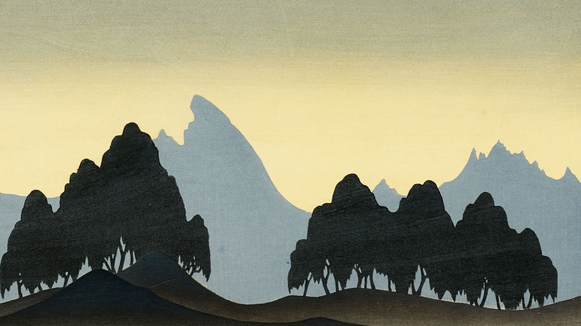 A landscape at dusk or dawn with silhouetted mountains and trees against a gradient sky. The sky transitions from a warm yellow at the horizon to a deep blue at the top, suggesting either sunrise or sunset. The mountains are layered, with the closest range being dark and detailed with trees, while the ranges behind fade into lighter shades of blue, creating depth.